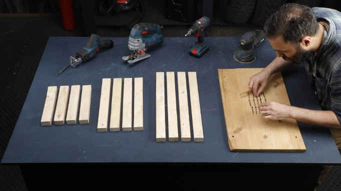 a man preparing the material for making a wooden table