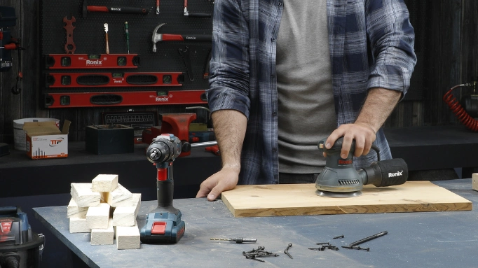 man finishing a table top