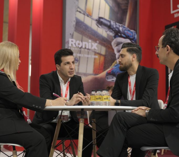 people discussing about something by the table