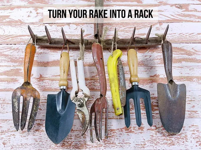 using a rake as a garden tool organizer