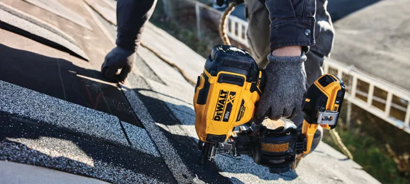 Professional using the new DEWALT Cordless Roofing Nailer