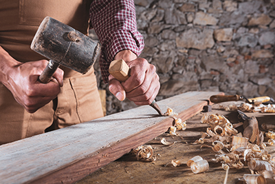 A mallet is used to drive a chisel.